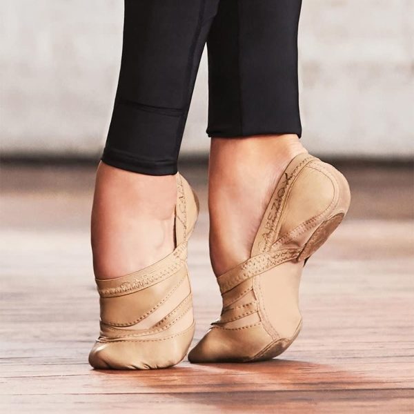closeup of model wearing Capezio Freeform Jazz Dance Shoe on a dance studio wood floor