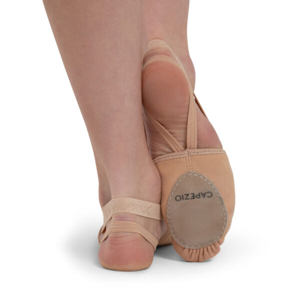 model posing in tan capezio pirouette ii dance shoes, back and bottom sole view