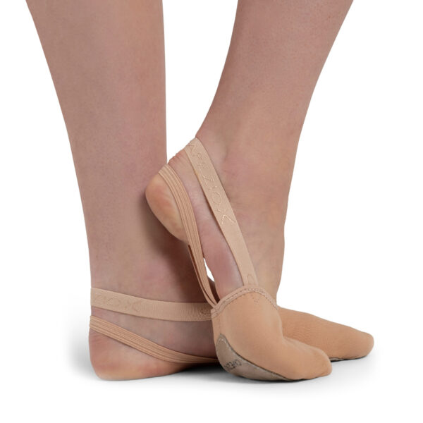 model posing in tan capezio pirouette ii dance shoes, right side view