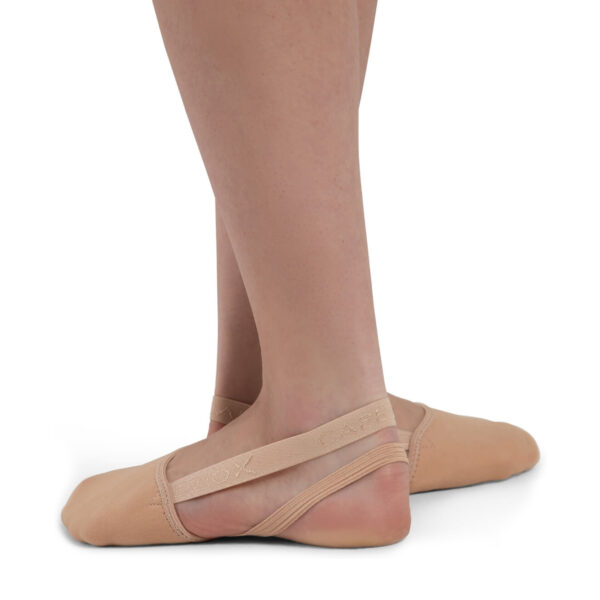 model posing in tan capezio pirouette ii dance shoes, left side view