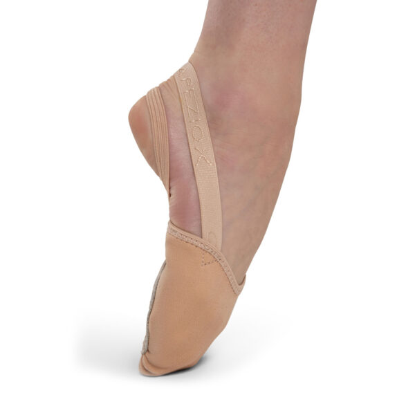 model posing in a toe point in tan capezio pirouette ii dance shoes, right side view