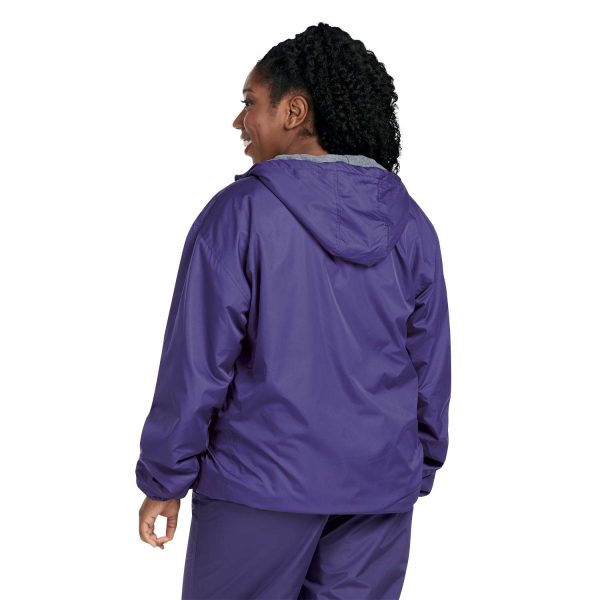 woman in a Champion Stadium Hooded Jacket with coordinating pants, back view