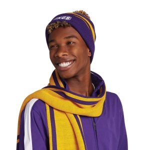 smiling model wearing a Holloway Homecoming Beanie with coordinating warmups and scarf, front detail