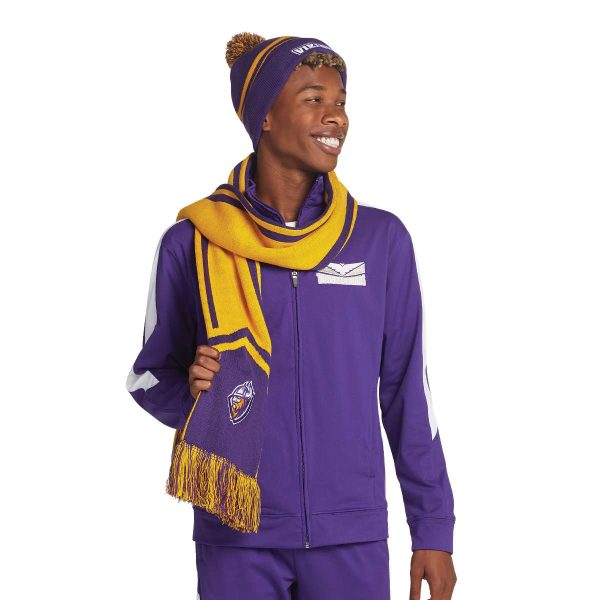 smiling model wearing a Holloway Homecoming Beanie with coordinating warmups and scarf, front view