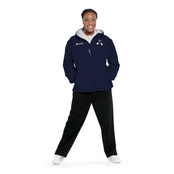 Model wearing a decorated navy Charles River Enterprise Jacket, standing front view