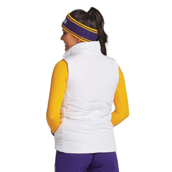 Model wearing a white Port Authority Puffy Vest with coordinating pants and accessories, back view