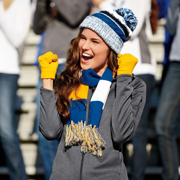 Sports fan cheering in a crowd wear a hat, gloves, and Sport-Tek Spectator Scarf