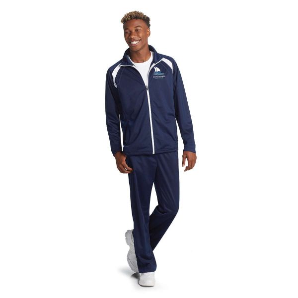 Model wearing a Men's Navy/White Sport-Tek Tricot Track Jacket and coordinating pants, front three-quarters view