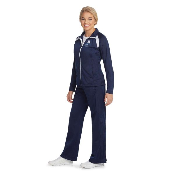 Model wearing a Women's Navy/White Sport-Tek Tricot Track Jacket and coordinating pants, front three-quarters view
