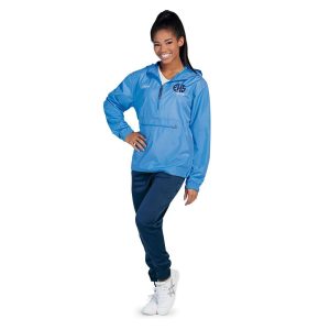 Model smiling in navy Pennant Performance Jogger Pants and blue hooded jacket, front view