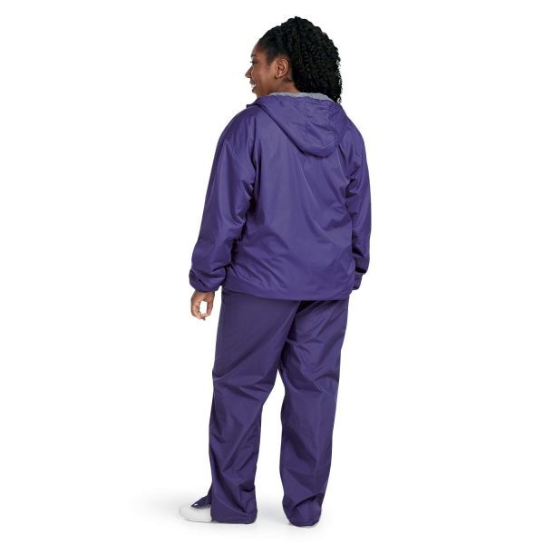 Female model standing in Purple Champion Trailblazer Warm Up Pants with coordinating jacket, Back View