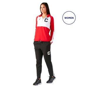 Model standing in Asics Stretch Woven Track Pants and matching jacket, front three-quarters view