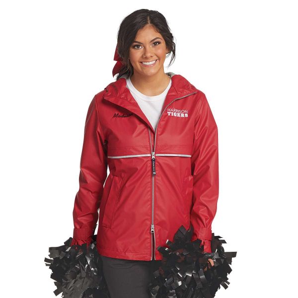 Cheerleader wearing a Ladies Charles River New Englander Jacket holding poms, front view