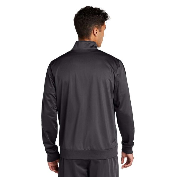 Man posing in a grey Sport-Tek Stripe Tricot Track Jacket with matching pants, back view