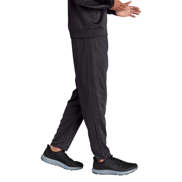 Male Model posing Sport-Tek Tricot Track Joggers, front three-quarters view