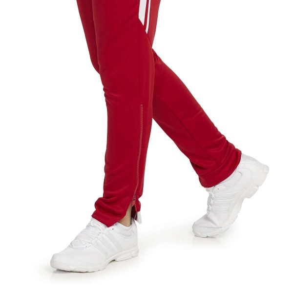 female model standing in Holloway Retro Grade Warm Up Pants, ankle zipper detail