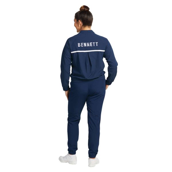 female model standing in Holloway Weld Jogger Warm Up Pants and matching jacket, back view