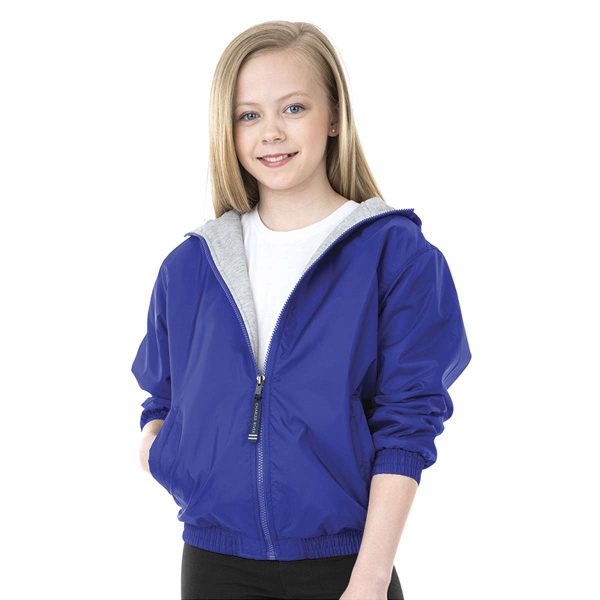 young model wearing a royal blue Charles River Performer Jacket, sleeves pulled up, front view