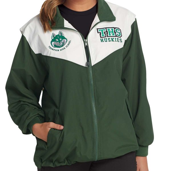 model wearing a green and white Charles River Championship Jacket, front detail