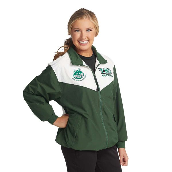 model wearing a green and white Charles River Championship Jacket, front view