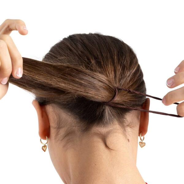 model putting a dark brown capezio bunheads hair tie in her hair