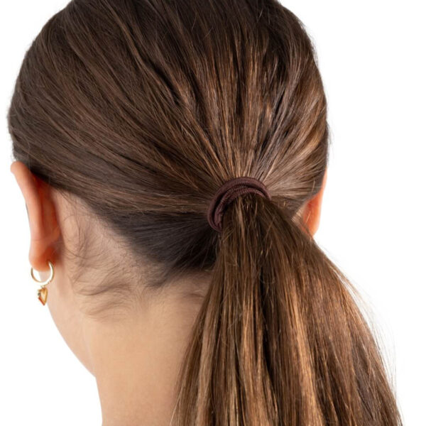 model with a dark brown capezio bunheads hair tie in her hair