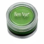 bright green ben nye creme makeup in a clear compact