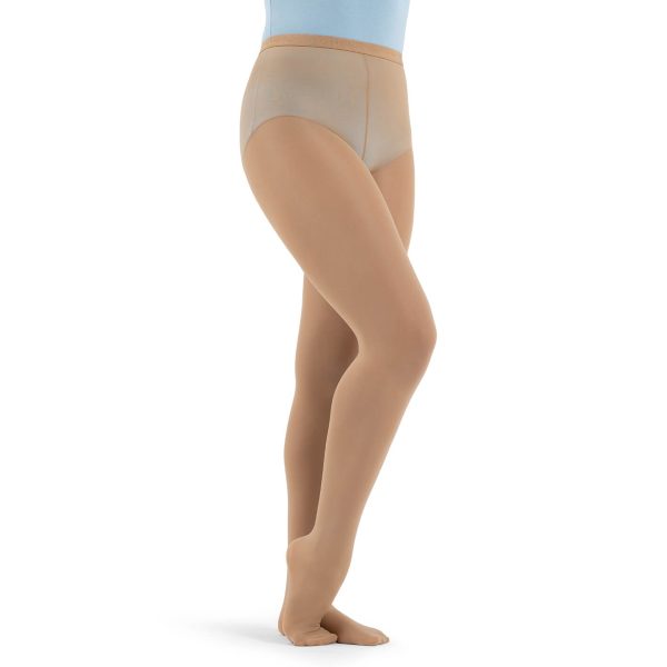 Model wearing caramel capezio hold and stretch footed tight, front three-quarters view