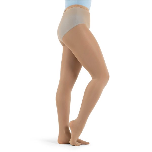 Model wearing caramel capezio hold and stretch footed tight, side view