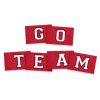 white letters with a black outline on red flags that reads "go team"