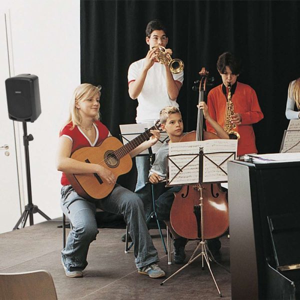 youth orchestra playing music on a stage, with a Samson Expedition Escape+ PA System in the background