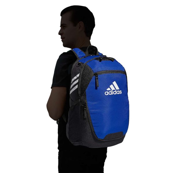 silhouetted model holding a blue/black adidas Stadium 3 Backpack