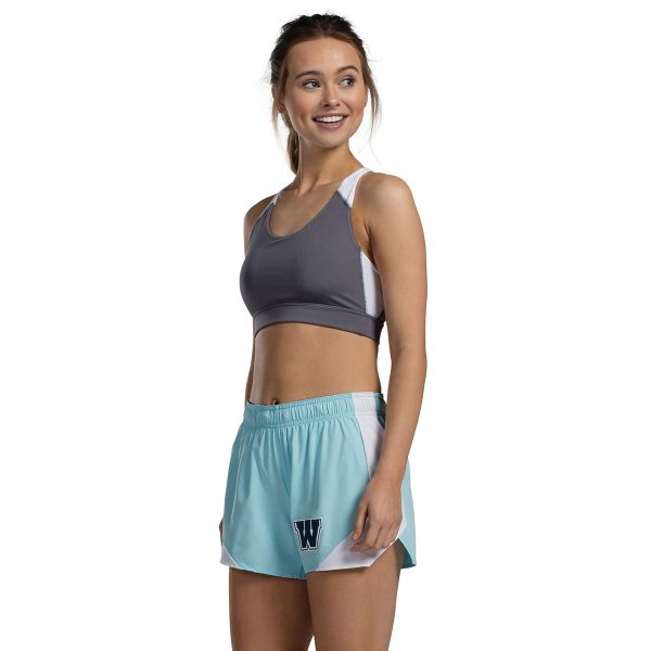 model wearing a grey/white augusta all sport sports bra with aqua shorts, three-quarter view