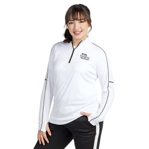 model posing in a white Pennant Conquest Quarter Zip, front view