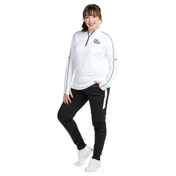 standing model posing in a white Pennant Conquest Quarter Zip, front view