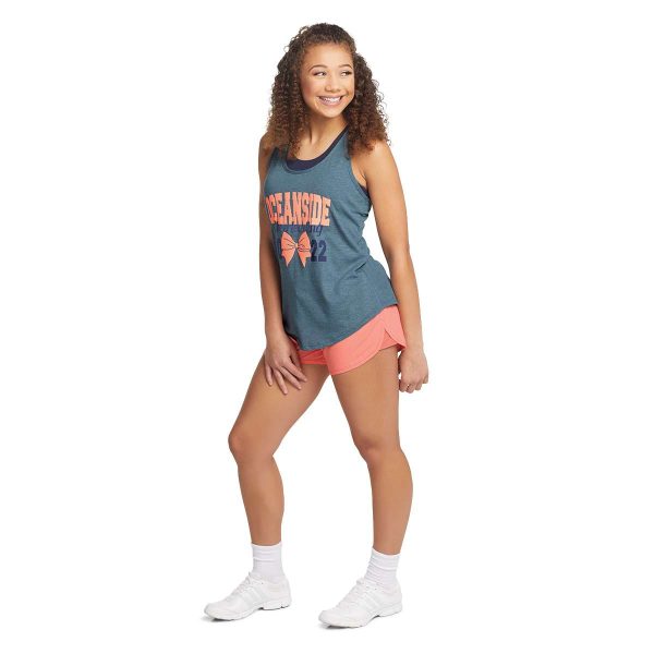 standing model posing in coral Augusta Wayfarer Cheer Shorts, front three-quarters view