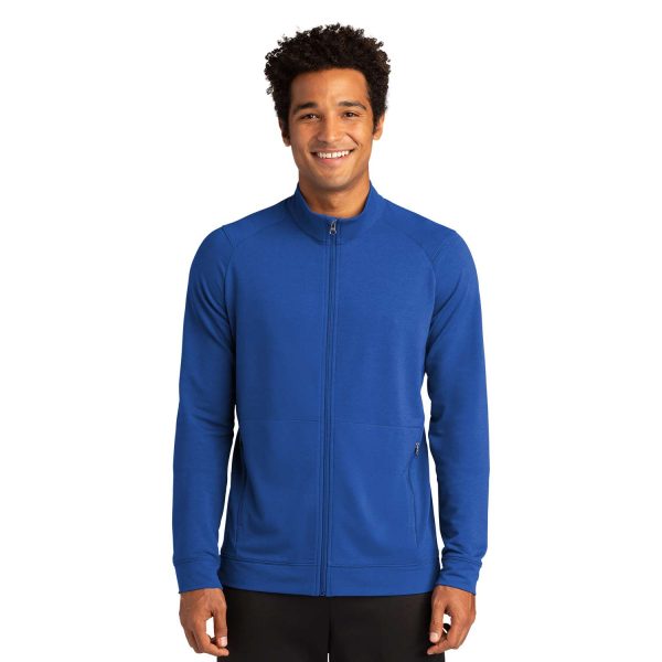 model in a royal blue Sport-Tek Sport-Wick Flex Fleece Jacket, front view