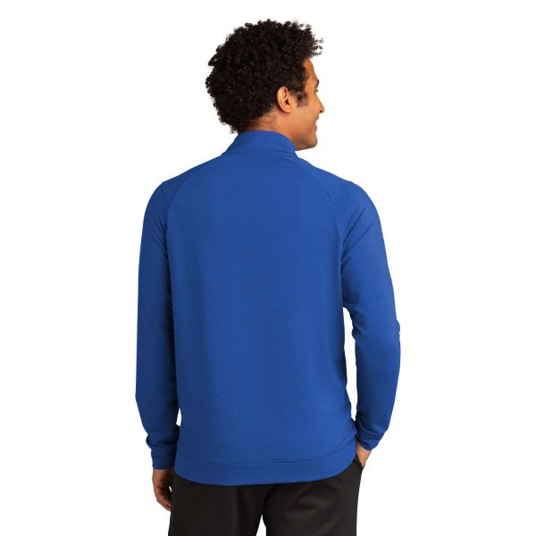 model in a royal blue Sport-Tek Sport-Wick Flex Fleece Jacket, back view