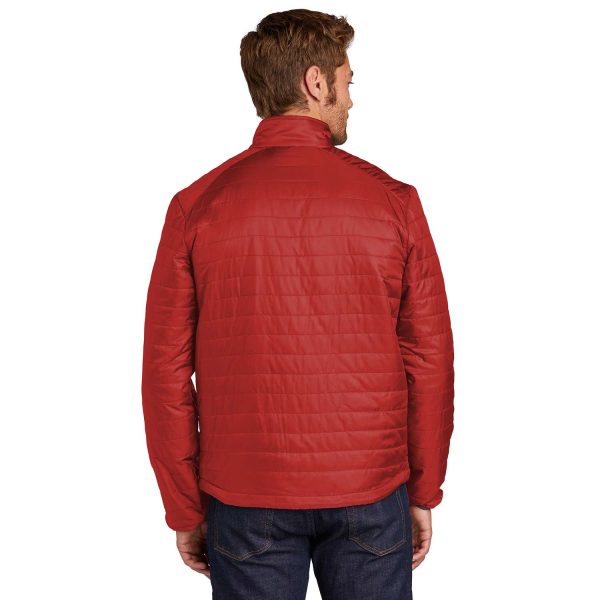 male model wearing a red Port Authority Packable Puffy Jacket, back view