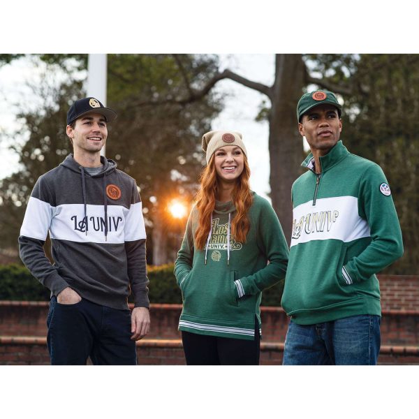 three people hanging out on a campus in the evening, one wearing a Dark Green Heather Holloway All-American Pullover
